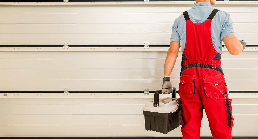 Caucasian Residential Garage Gate Installer Finishing His Job