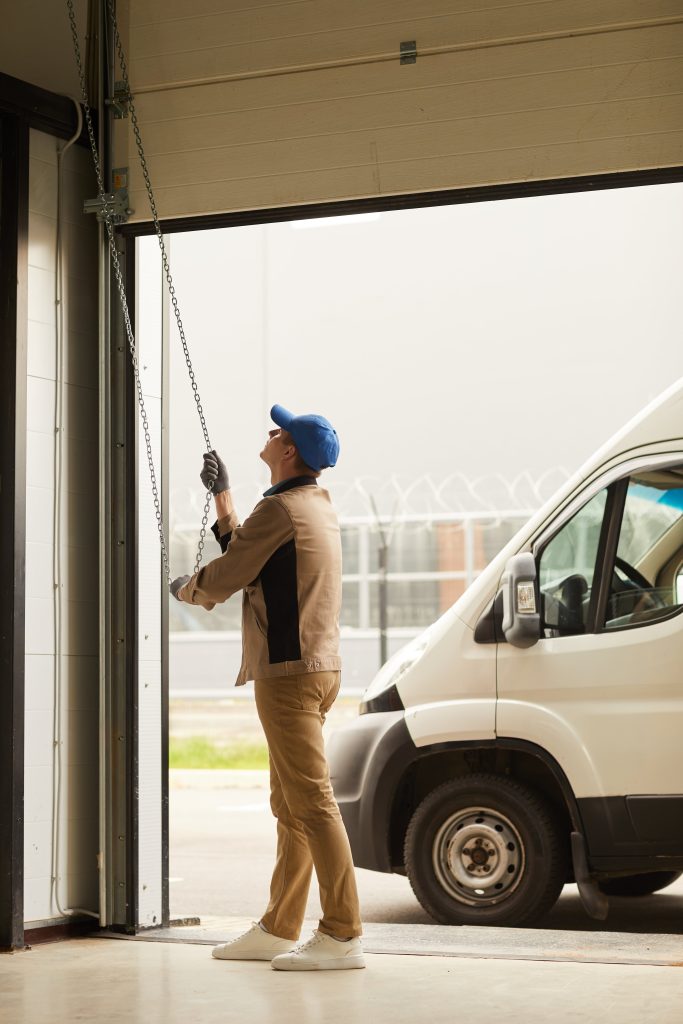 Person opening a garage door