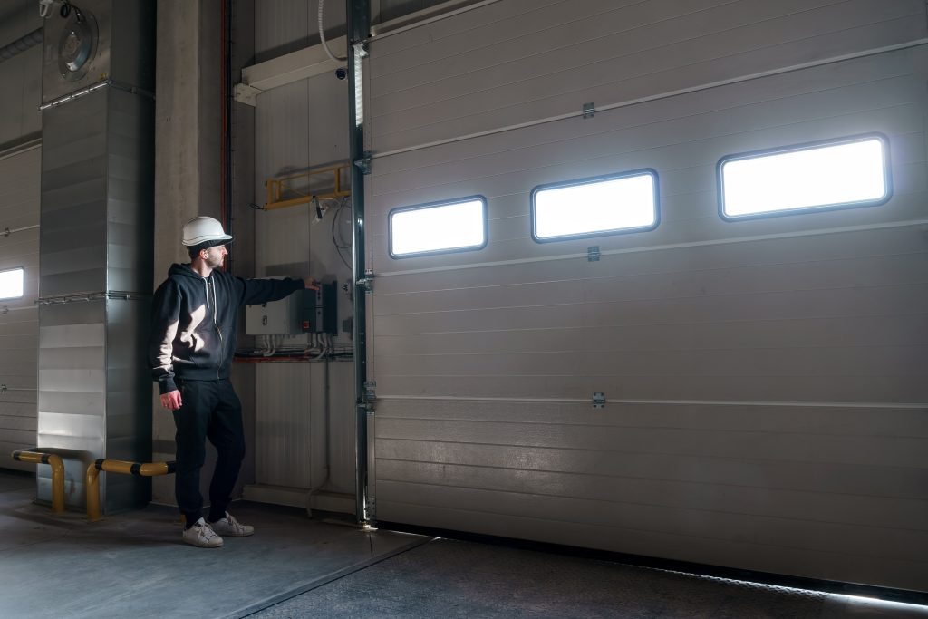 Person opening a garage door