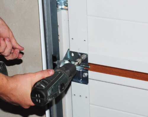 Contractor repair and replace garage door. Garage door installation.
