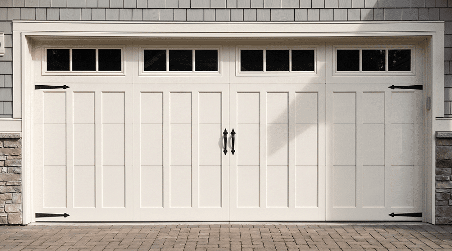 Clean white carriage-style residential garage door with black hinges and glass panels installed by Select Garage Doors