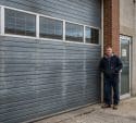 mad beside a commercial garage door