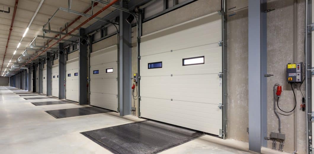 commercial garage door maintenance on warehouse