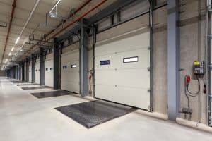 commercial garage door maintenance on warehouse